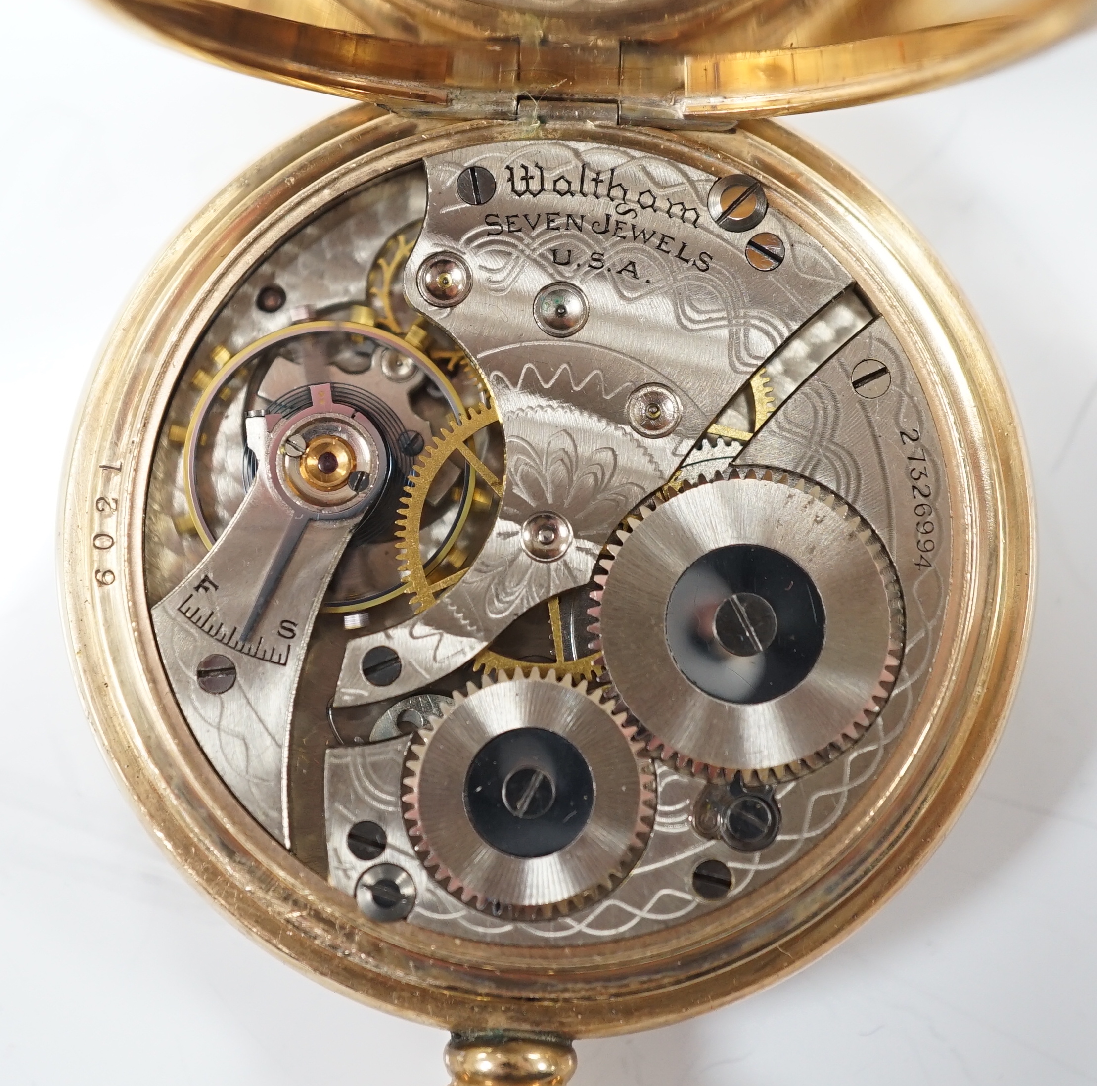 A Waltham gold plated open face keyless pocket watch, with Roman dial and subsidiary seconds.